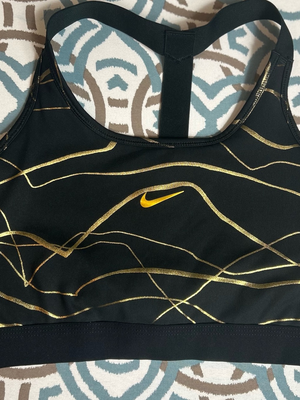 Nike Women’s Black Sports Bra with Gold Accent Swoosh